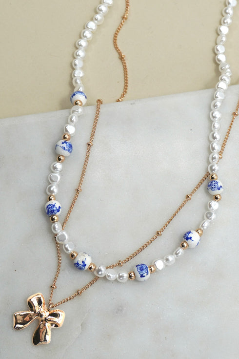 PEARL BOW LAYER NECKLACE